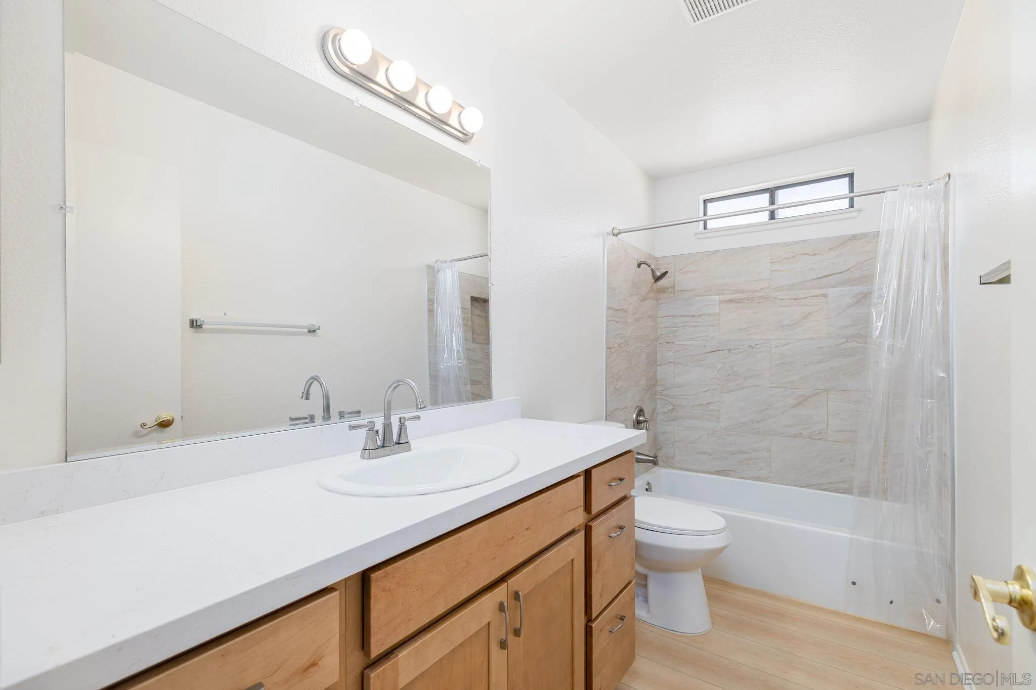 27971 Red Dawn Drive Menifee, CA 92585 - Photo 19 of 42 a bathroom with a sink a toilet and shower