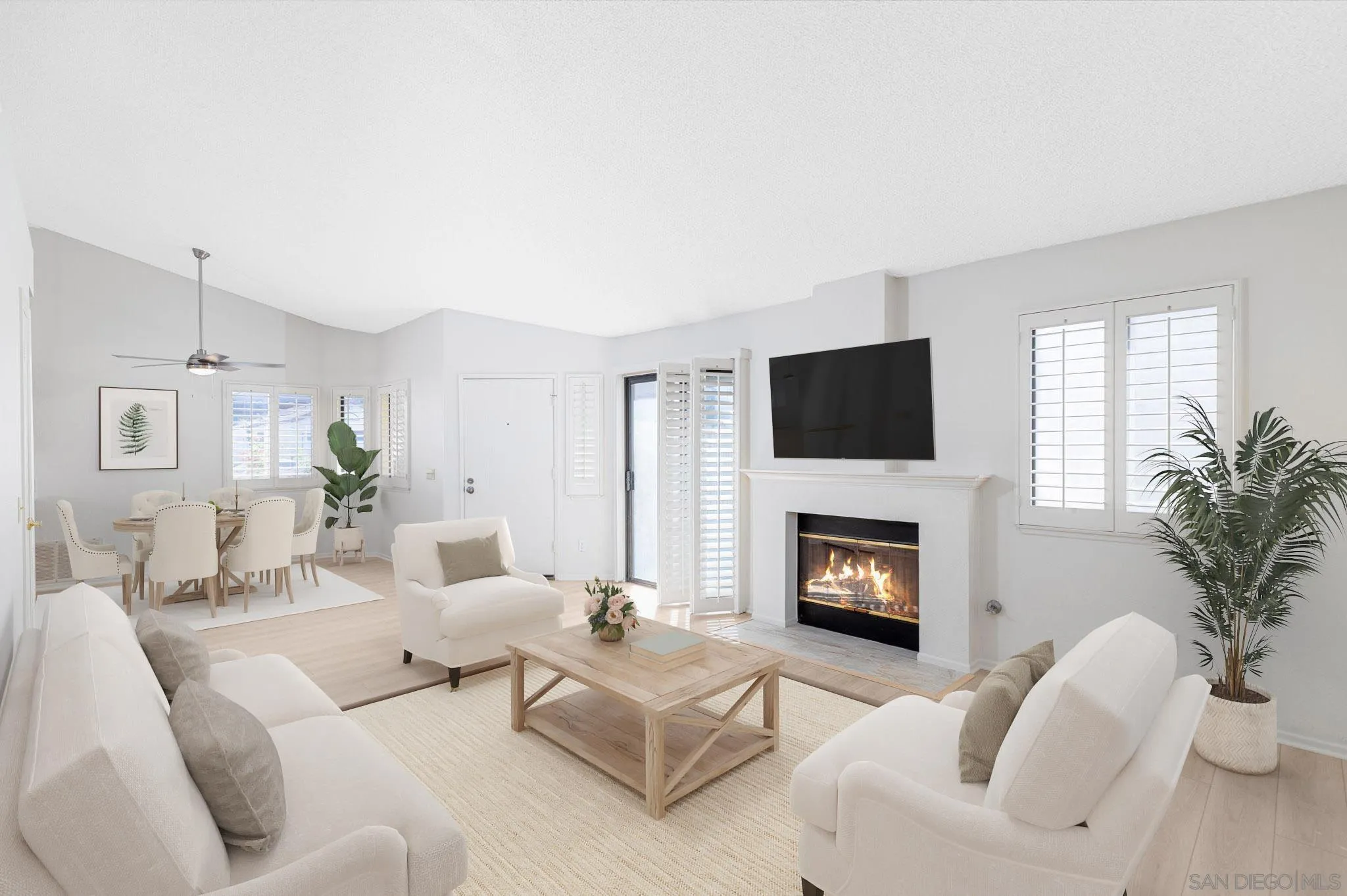 27971 Red Dawn Drive Menifee, CA 92585 - Photo 2 of 42 a living room with furniture a fireplace and a flat screen tv