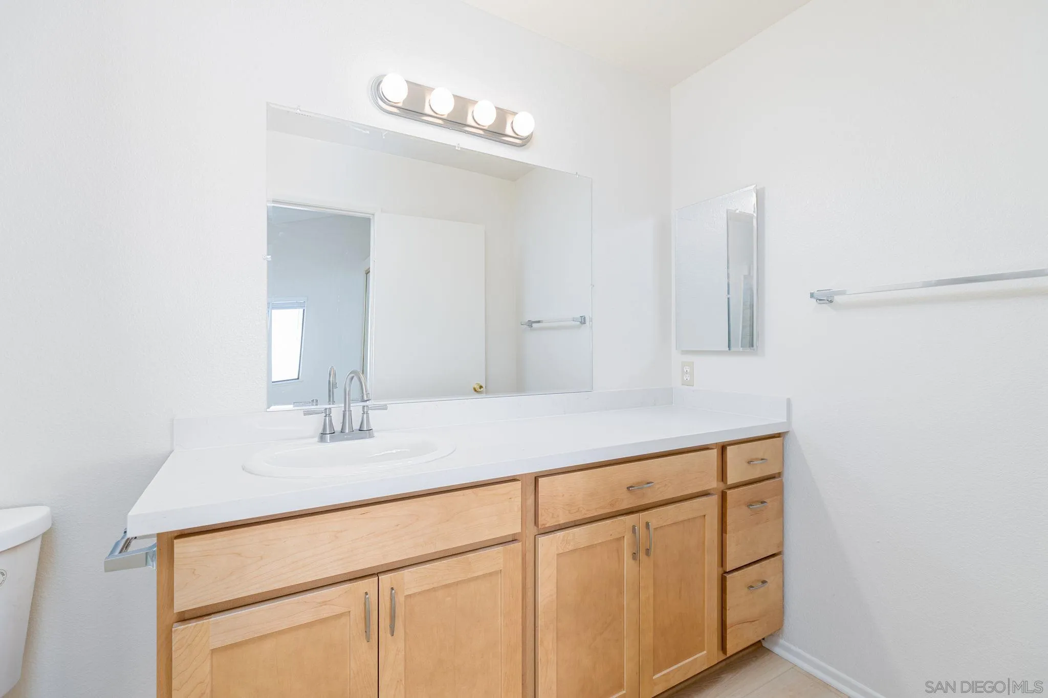 27971 Red Dawn Drive Menifee, CA 92585 - Photo 24 of 42 a bathroom with a sink and a mirror