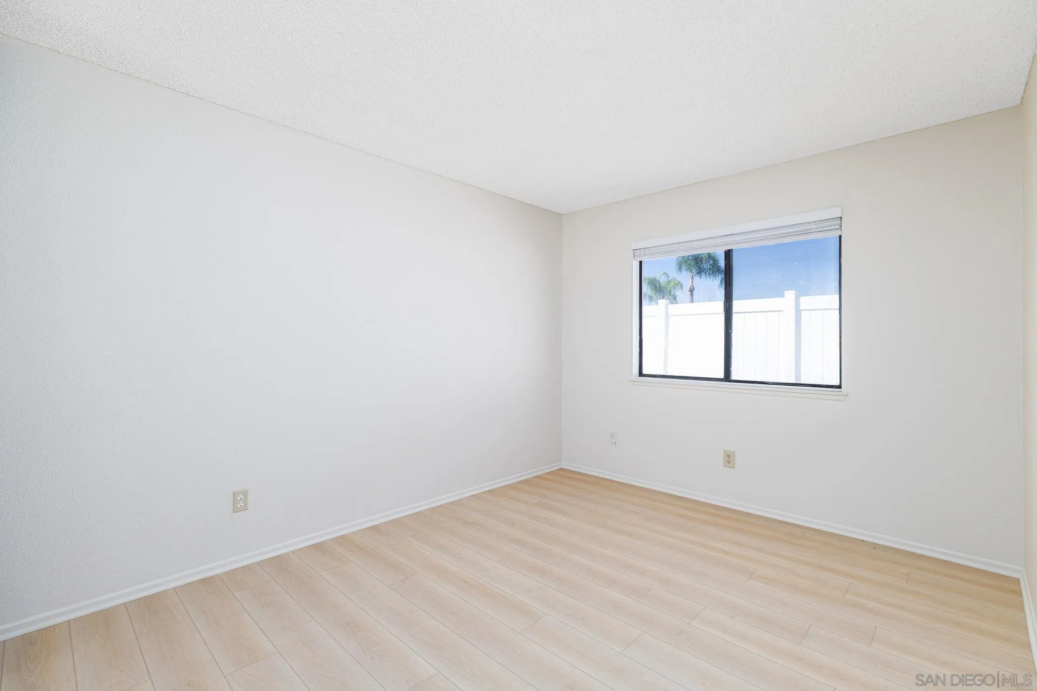 27971 Red Dawn Drive Menifee, CA 92585 - Photo 25 of 42 an empty room with a window