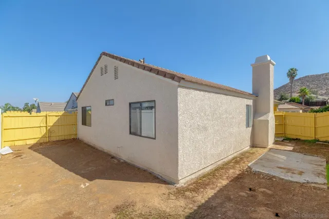 a view of a back yard of a house