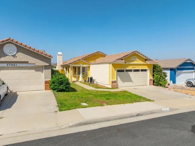 front view of a house with a yard