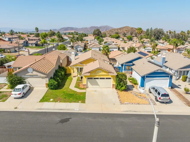 an aerial view of residential houses with outdoor space