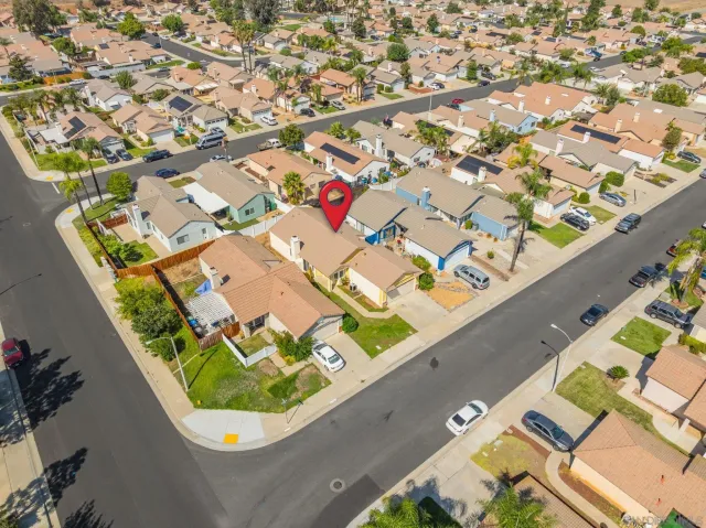 an aerial view of residential house with outdoor space and swimming pool