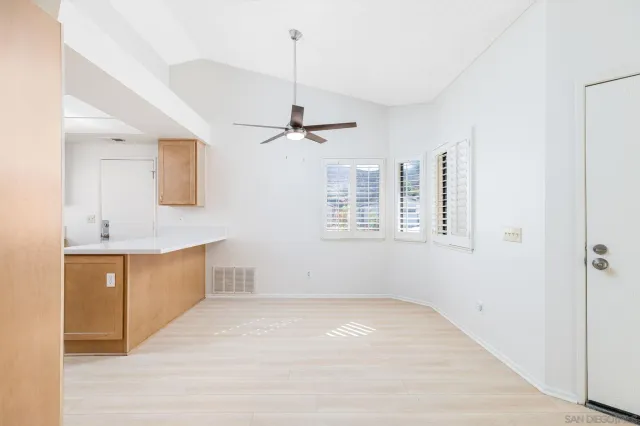 a view of a kitchen with a sink and dishwasher cabinet