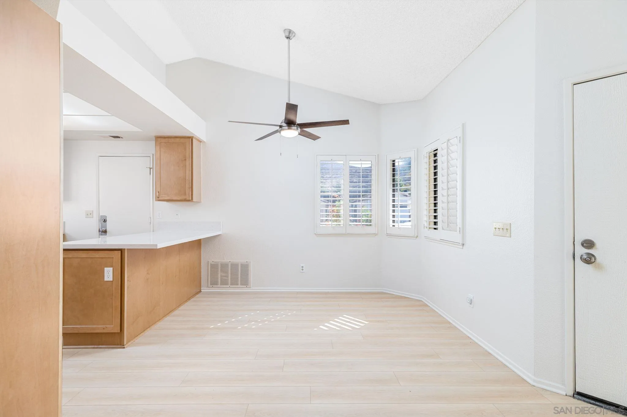 27971 Red Dawn Drive Menifee, CA 92585 - Photo 8 of 42 a view of a kitchen with a sink and dishwasher cabinet