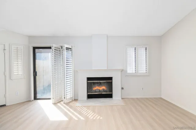 an empty room with a fireplace