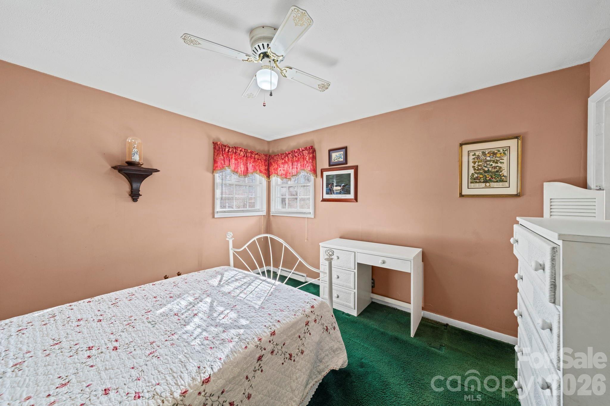 5 Cartwright Street York, SC 29745 - Photo 19 of 28 a bedroom with a bed and a chandelier