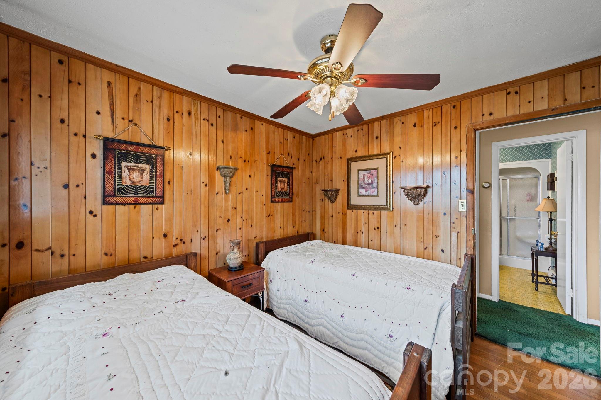 5 Cartwright Street York, SC 29745 - Photo 21 of 28 a bedroom with a bed and a chandelier