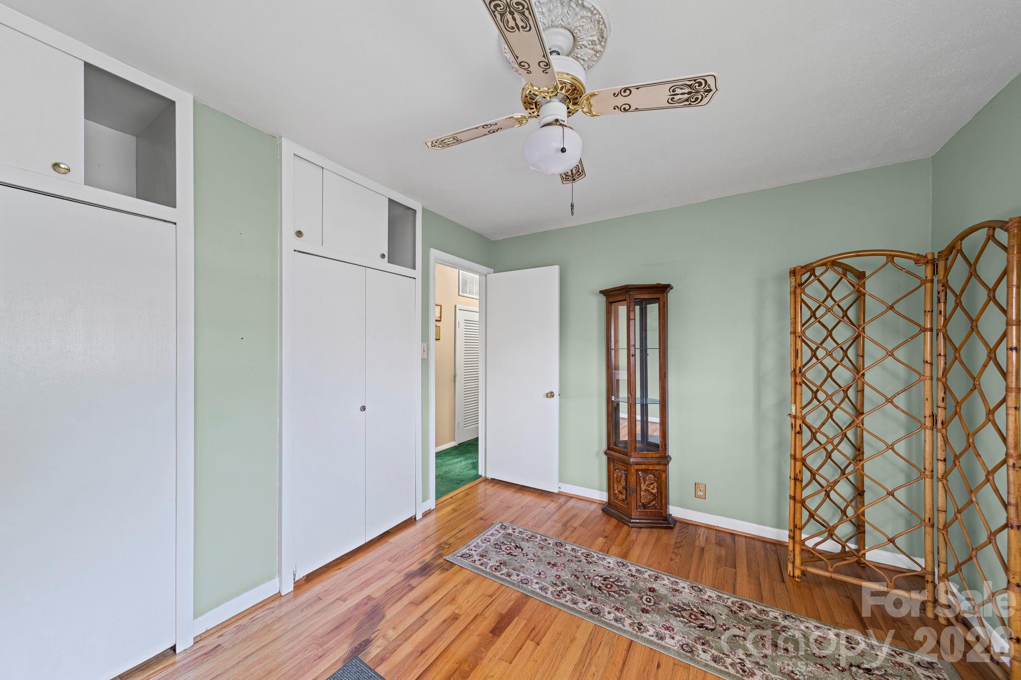5 Cartwright Street York, SC 29745 - Photo 23 of 28 a bedroom with a bed and a chandelier