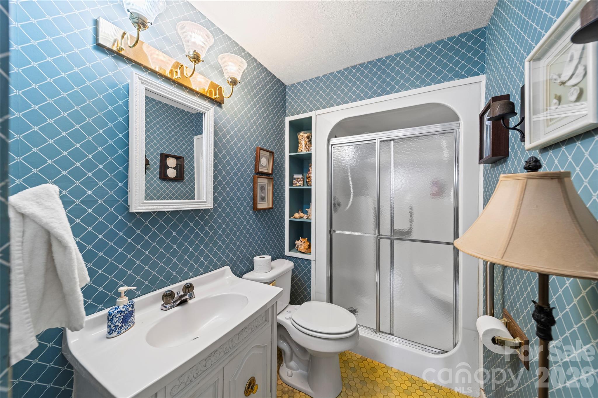 5 Cartwright Street York, SC 29745 - Photo 24 of 28 a white toilet sitting next to a bathroom sink