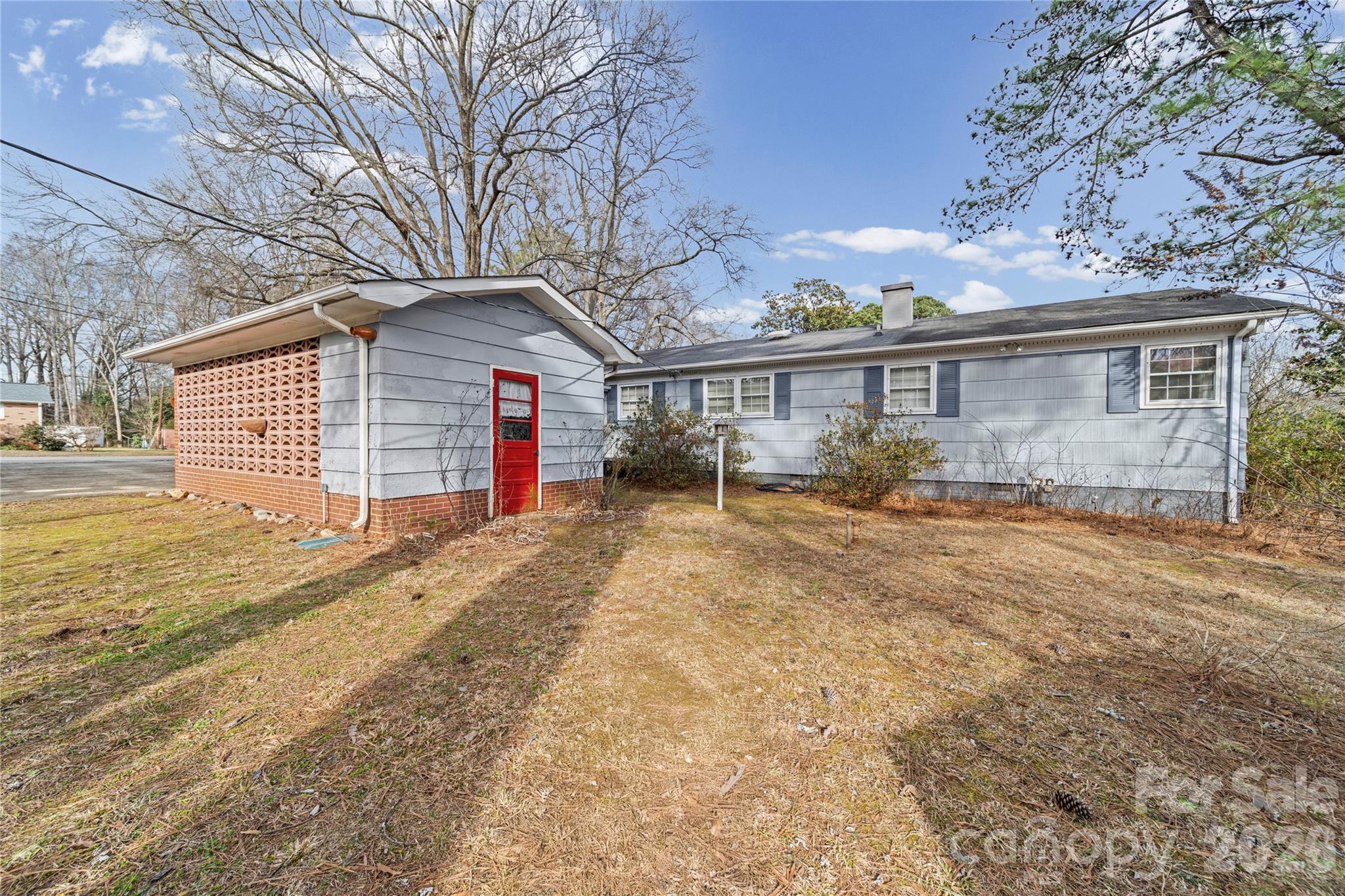 5 Cartwright Street York, SC 29745 - Photo 5 of 28 a view of a house next to a yard with potted plants