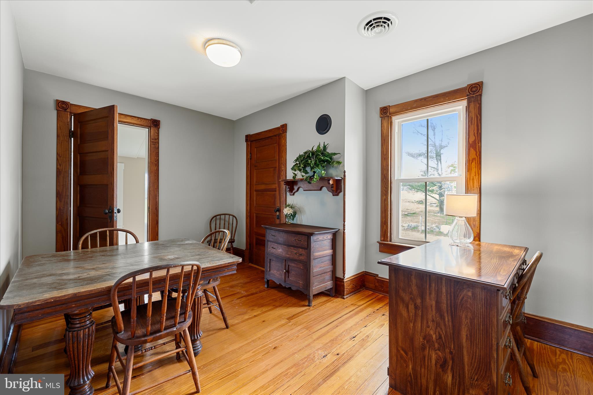 5452 Middle Road Winchester, VA 22602 - Photo 23 of 52 a view of a dining room with furniture window and wooden floor