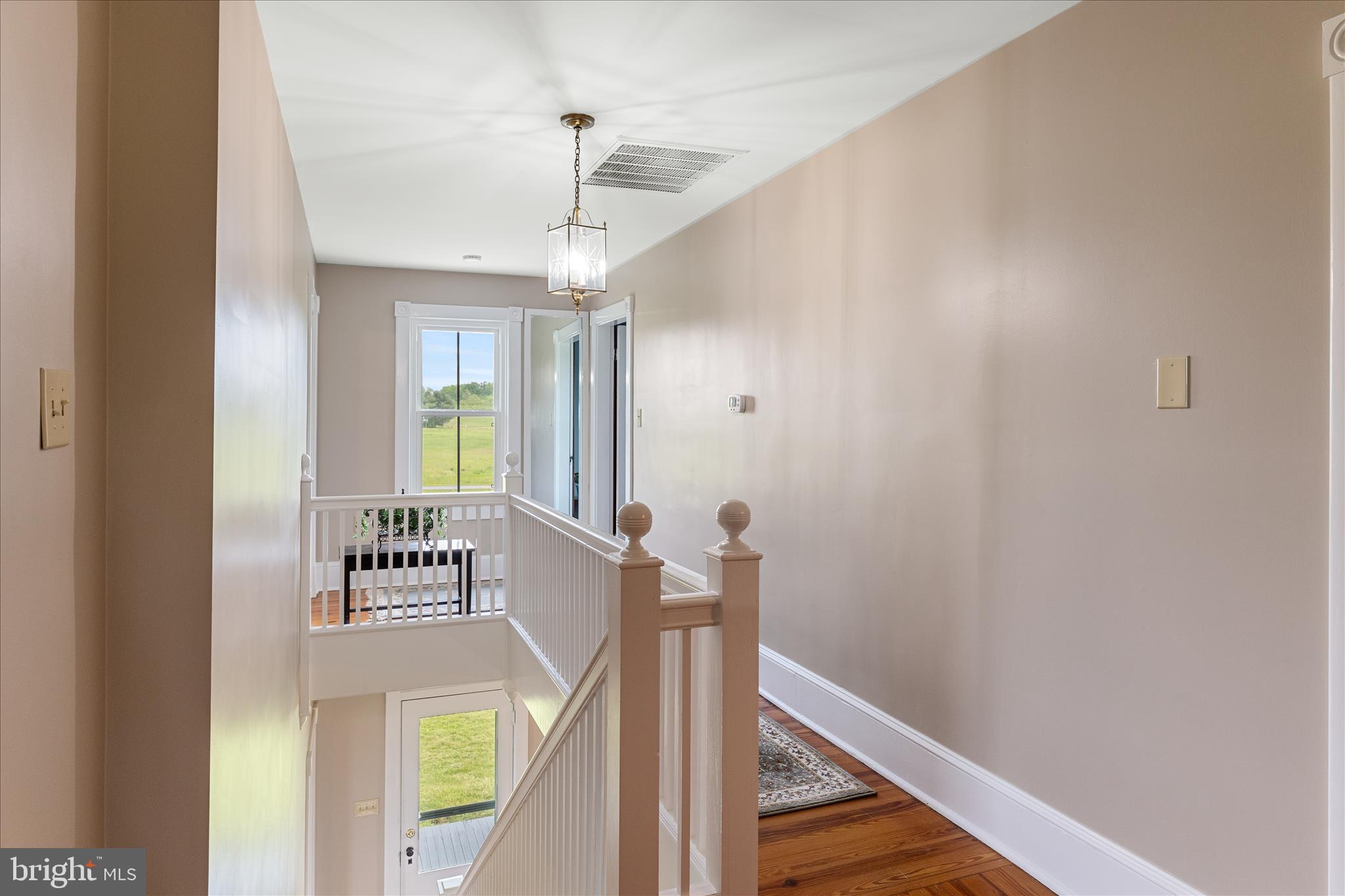 5452 Middle Road Winchester, VA 22602 - Photo 31 of 52 a view of a hallway with wooden floor and staircase