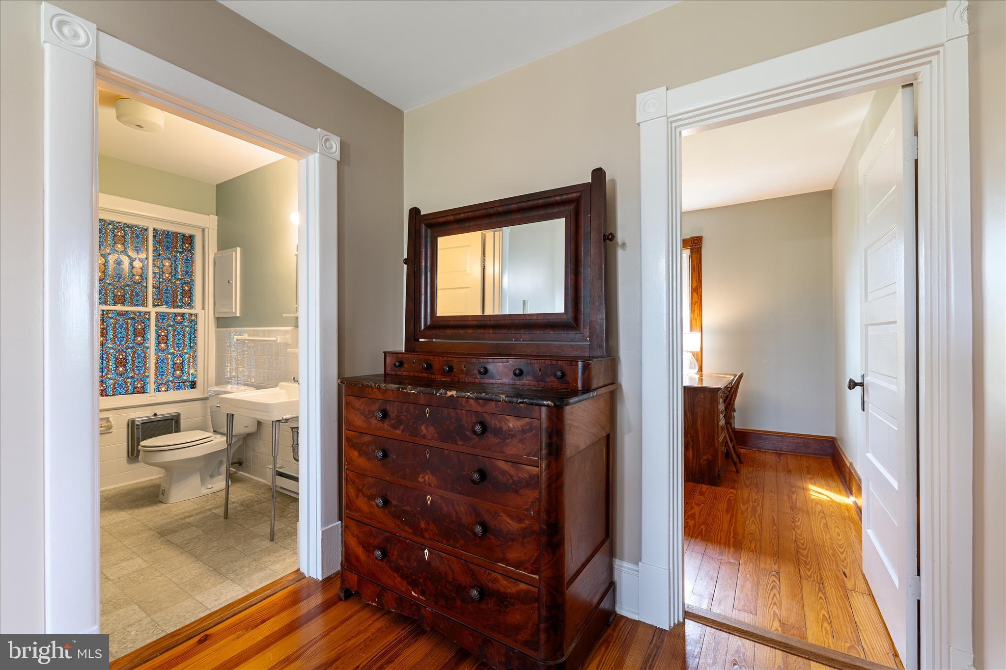 5452 Middle Road Winchester, VA 22602 - Photo 34 of 52 a view of a hallway with bathroom and wooden floor