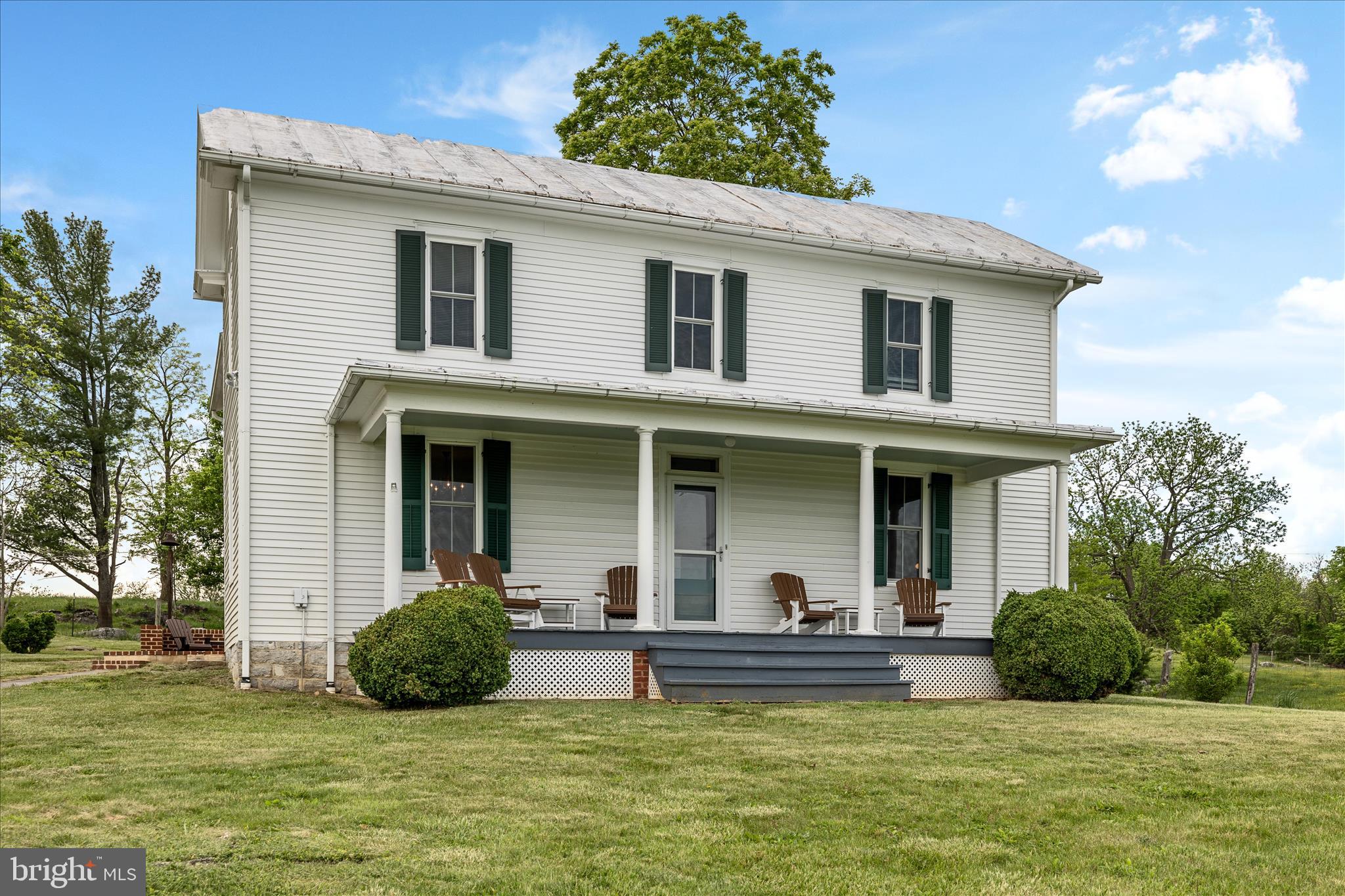 5452 Middle Road Winchester, VA 22602 - Photo 52 of 52 a view of a patio with couches chairs and swimming pool with a yard