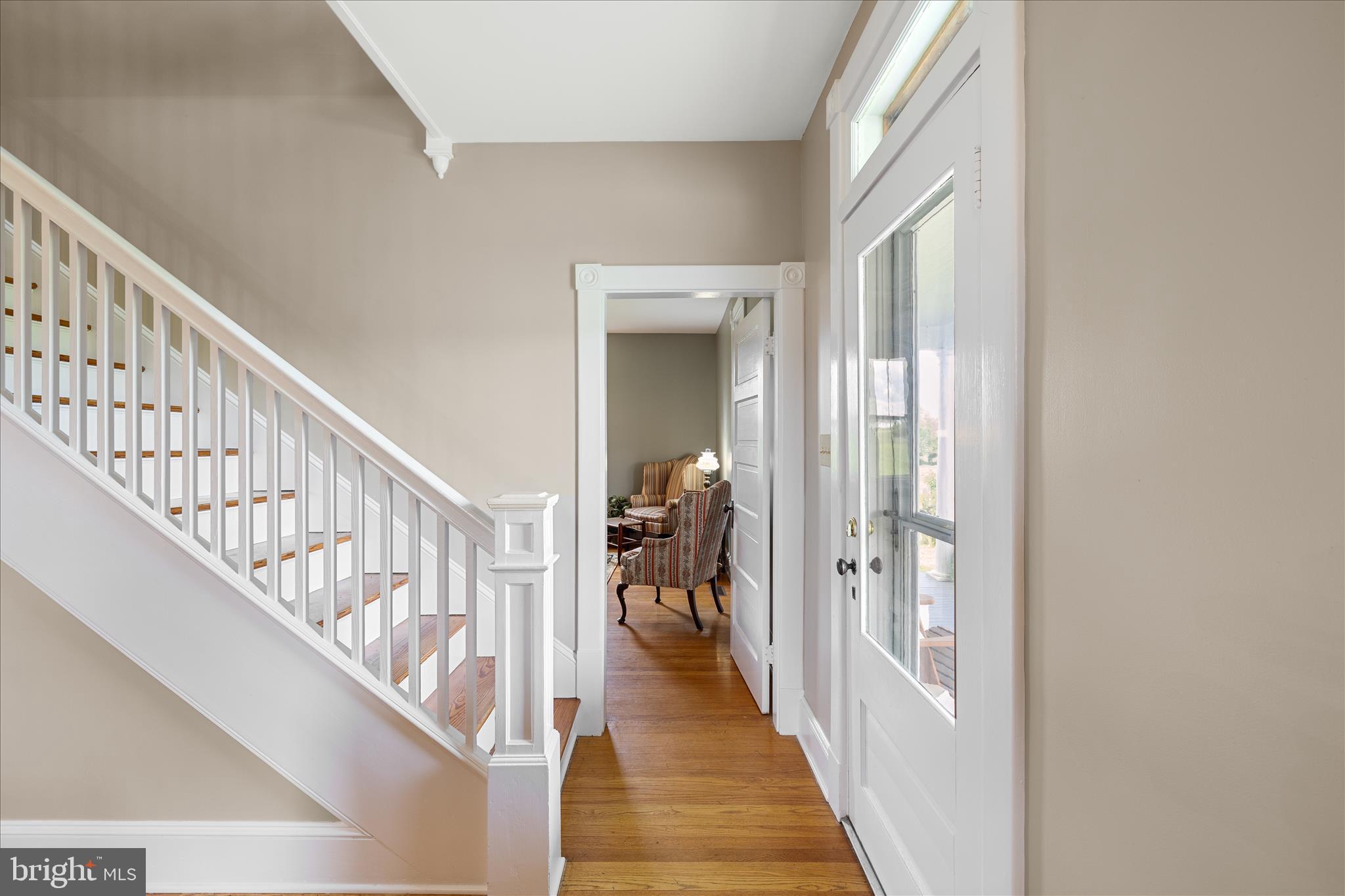 5452 Middle Road Winchester, VA 22602 - Photo 8 of 52 a view of a hallway with wooden floor and stairs