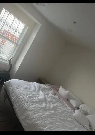 a bathroom with a granite countertop toilet a sink and a mirror