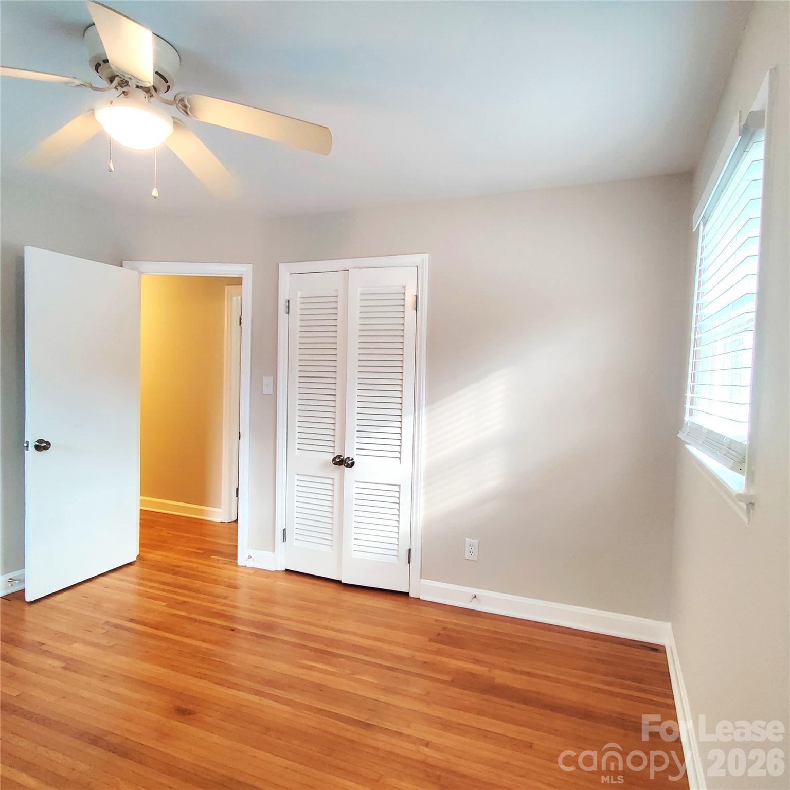4100 Broadview Drive Charlotte, NC 28217 - Photo 14 of 24 wooden floor in an empty room with a window
