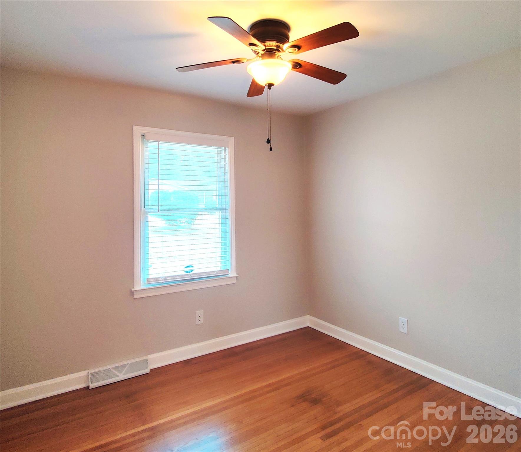 4100 Broadview Drive Charlotte, NC 28217 - Photo 16 of 24 wooden floor in an empty room with a window