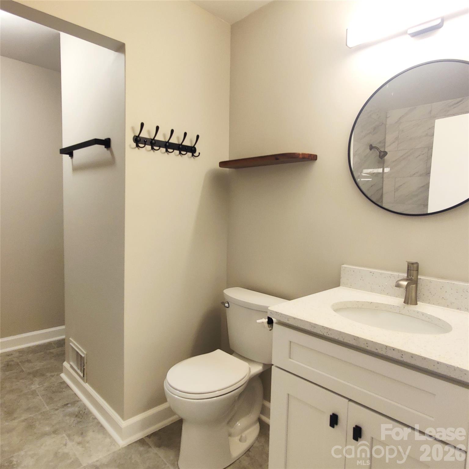 4100 Broadview Drive Charlotte, NC 28217 - Photo 18 of 24 a bathroom with a sink and a mirror