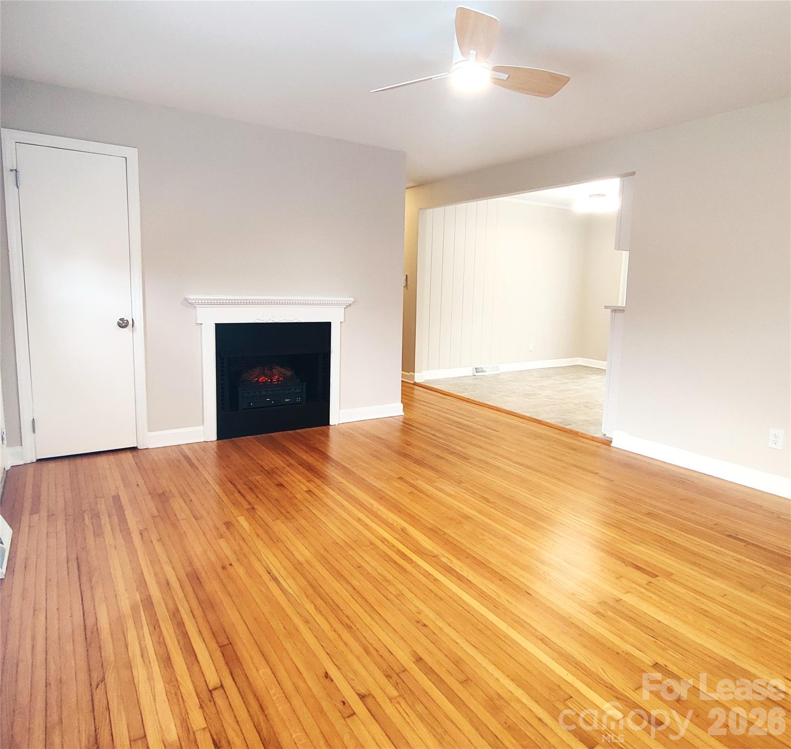 4100 Broadview Drive Charlotte, NC 28217 - Photo 10 of 24 an empty room with wooden floor and windows