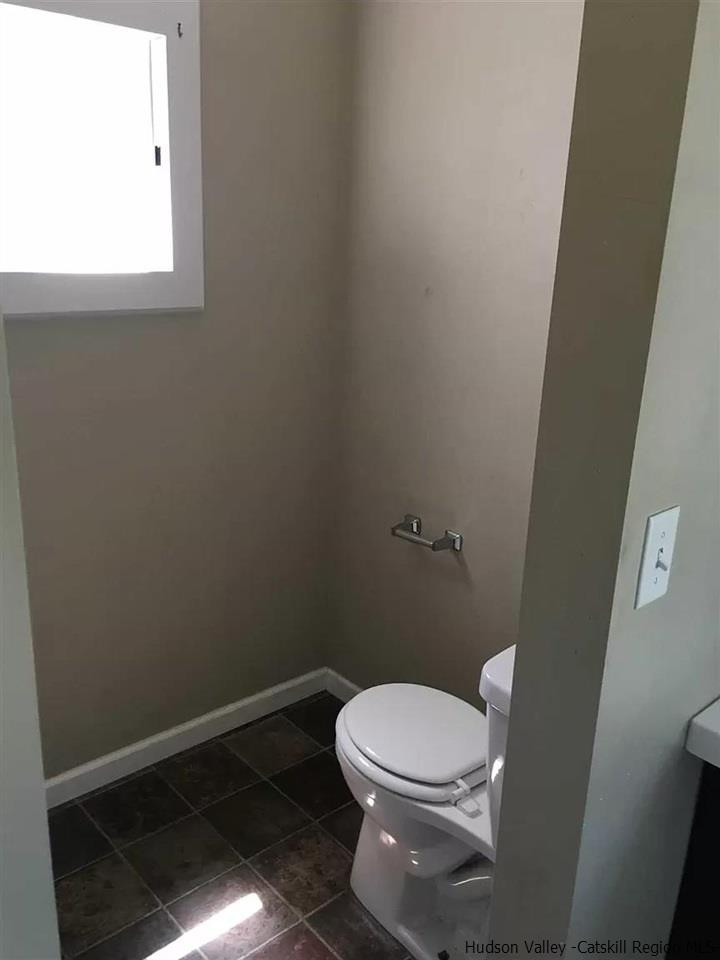 39 Spruce Street Poughkeepsie, NY 12601 - Photo 13 of 20 a white toilet sitting next to a window