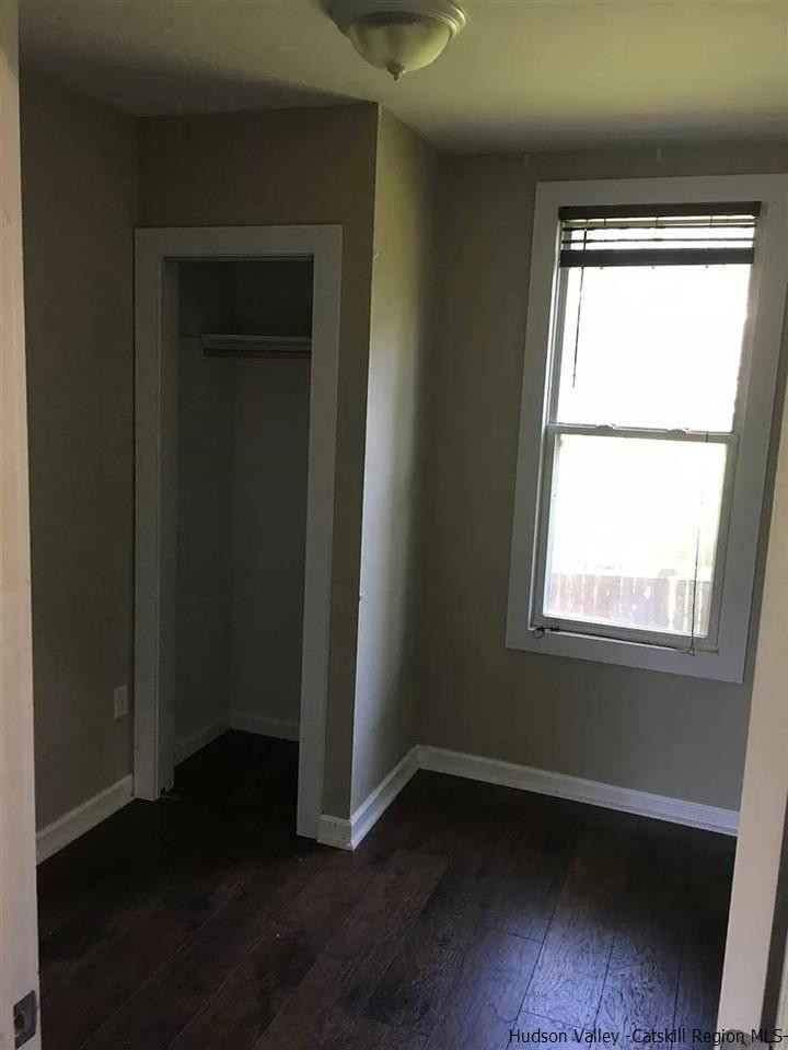 39 Spruce Street Poughkeepsie, NY 12601 - Photo 16 of 20 a view of an empty room with wooden floor and a window