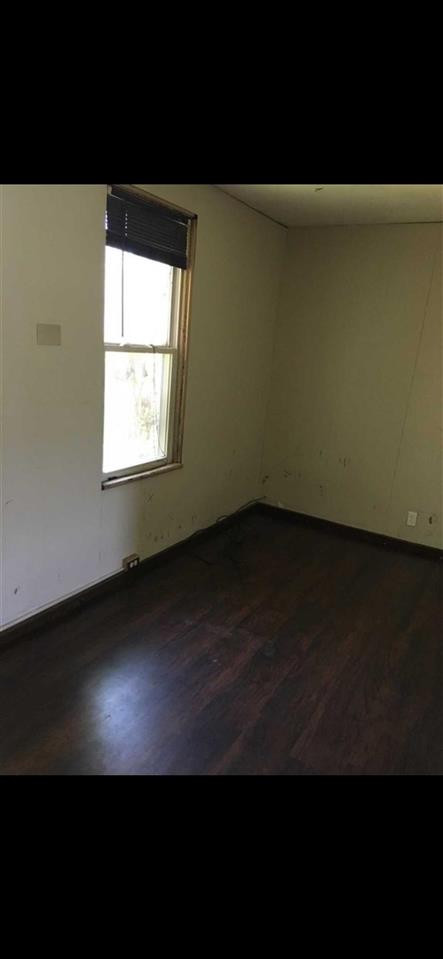 39 Spruce Street Poughkeepsie, NY 12601 - Photo 19 of 20 a view of an empty room with wooden floor and a window