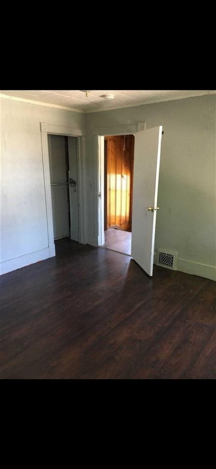 39 Spruce Street Poughkeepsie, NY 12601 - Photo 20 of 20 a view of an empty room with wooden floor and a window