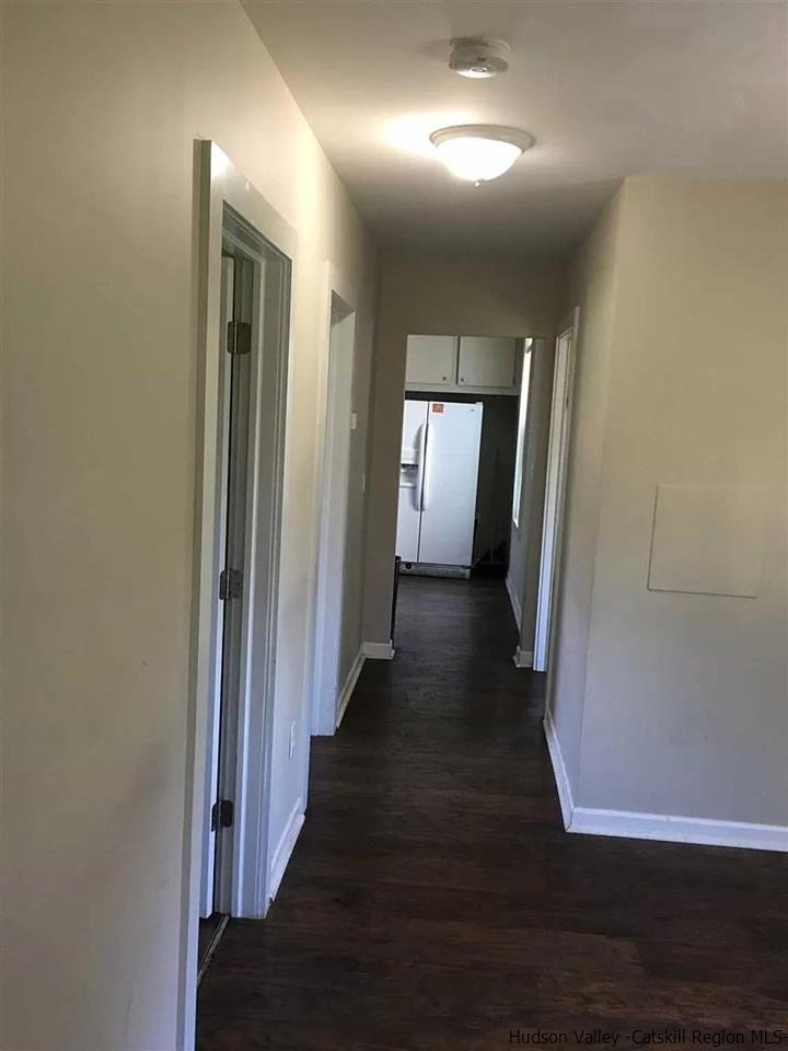39 Spruce Street Poughkeepsie, NY 12601 - Photo 4 of 20 a view of a hallway with wooden floor
