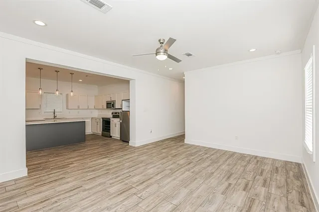 a view of kitchen with wooden floor and window