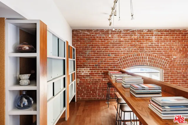 a front view of a house with outdoor seating