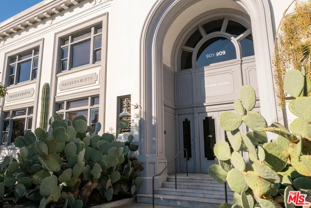 a view of balcony with chairs and table