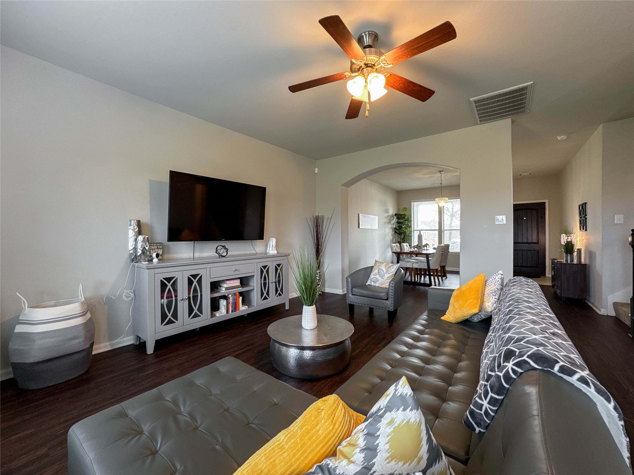 a living room with furniture and a flat screen tv