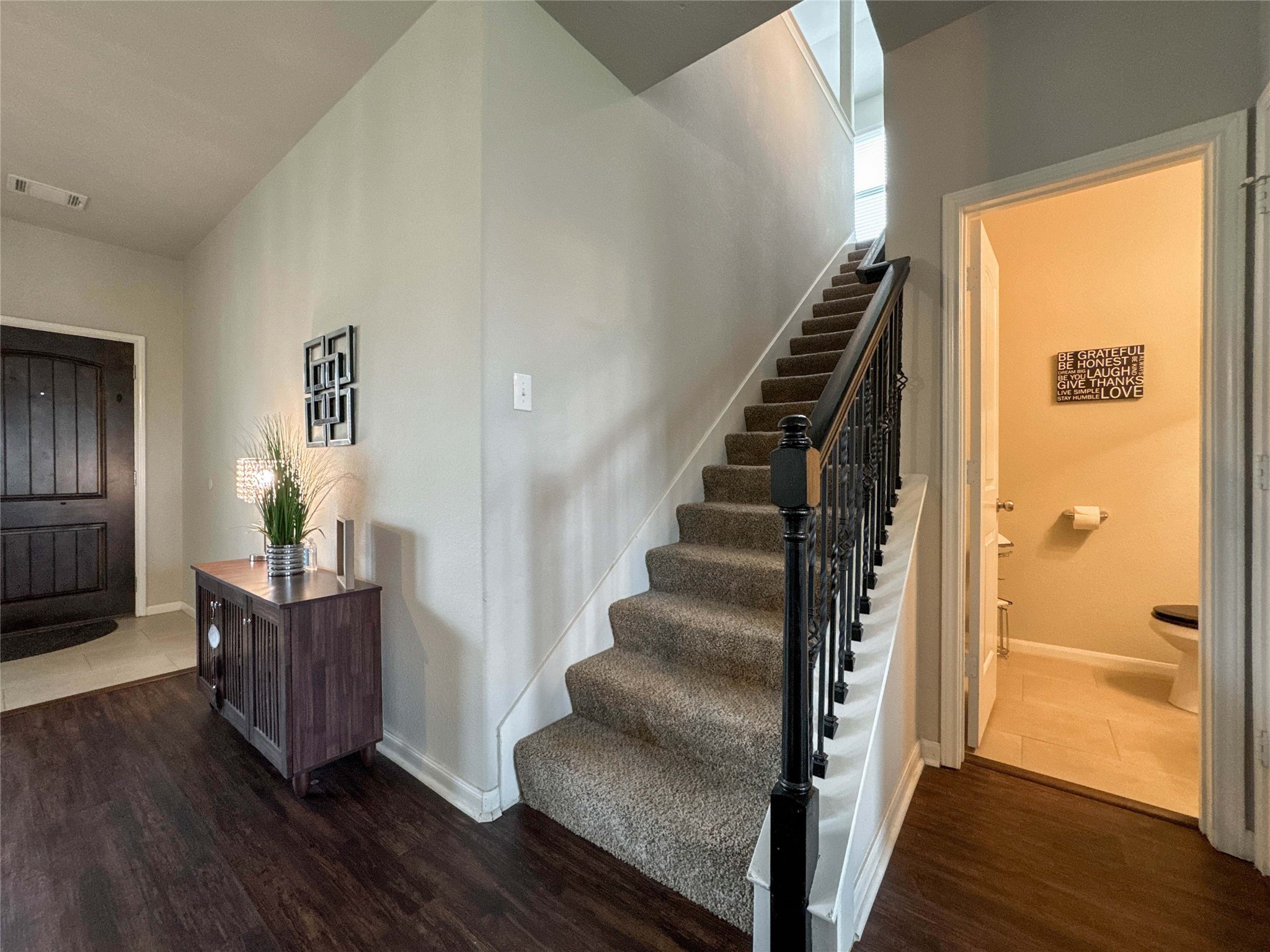 2 Eagle Lake Court Manvel, TX 77578 - Photo 17 of 38 a view of a hallway with wooden floor and staircase
