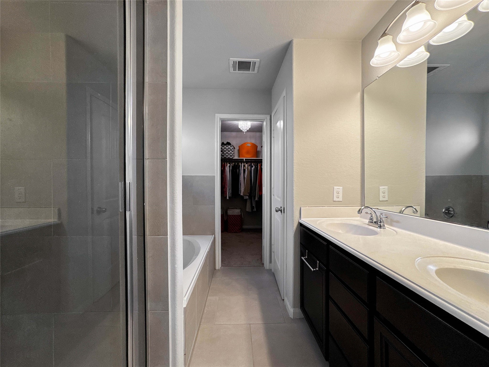 2 Eagle Lake Court Manvel, TX 77578 - Photo 27 of 38 a en suite bathroom with a double vanity sink and a mirror
