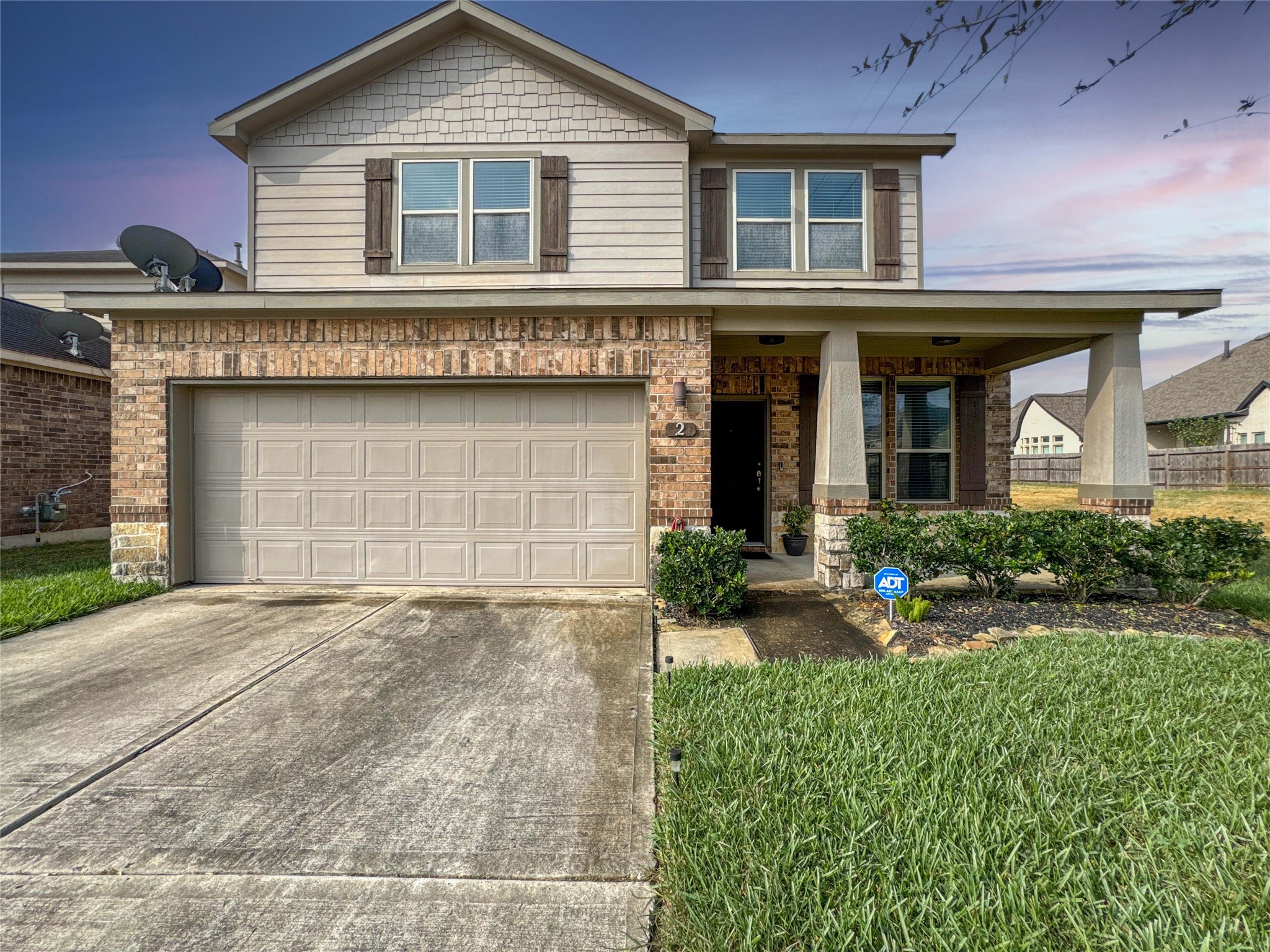 2 Eagle Lake Court Manvel, TX 77578 - Photo 36 of 38 a front view of a house with a yard and garage