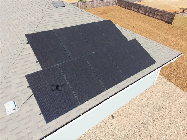 a view of ocean with large trees