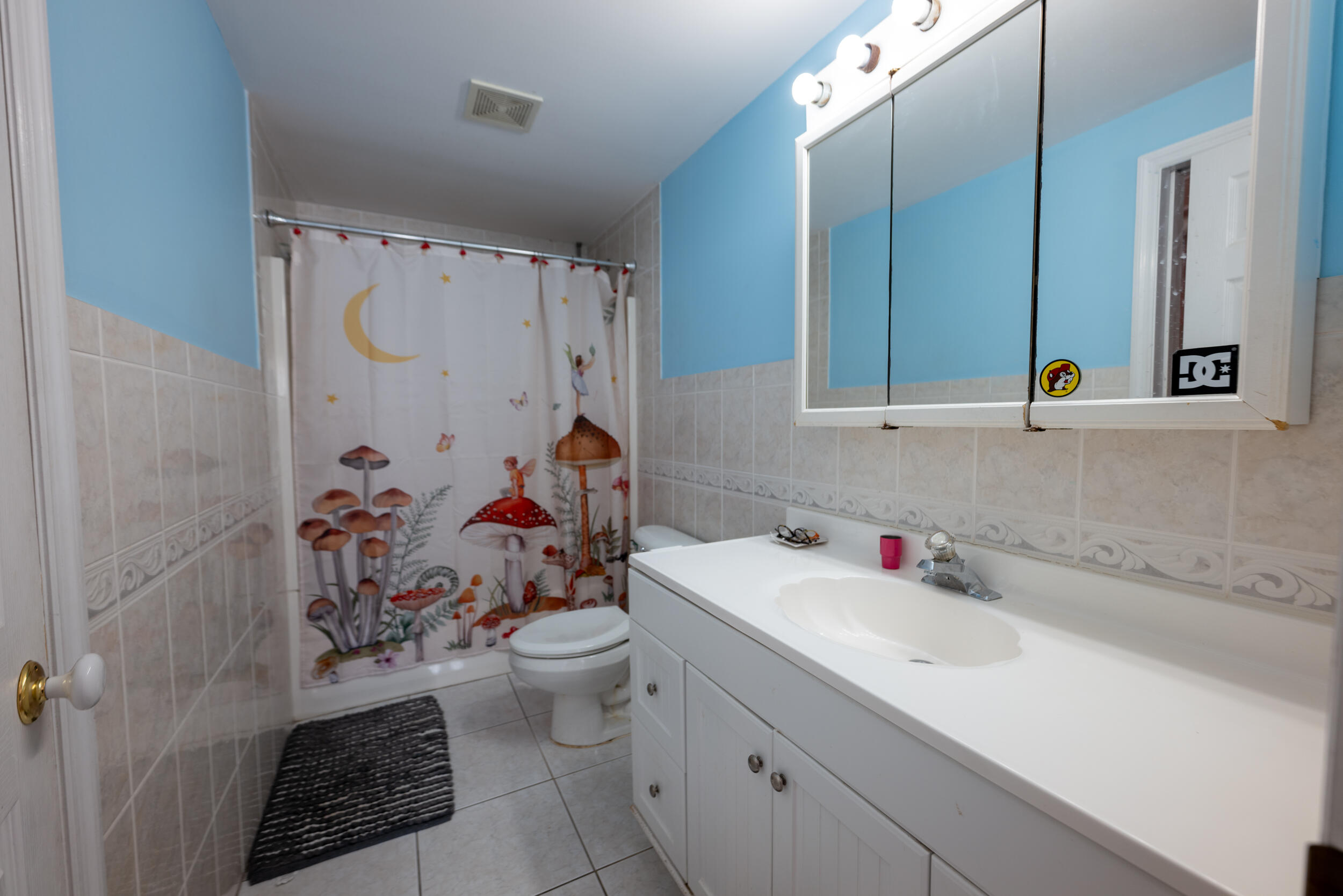 1229 5th Street Key West, FL 33040 - Photo 18 of 40 a bathroom with a sink toilet vanity and shower