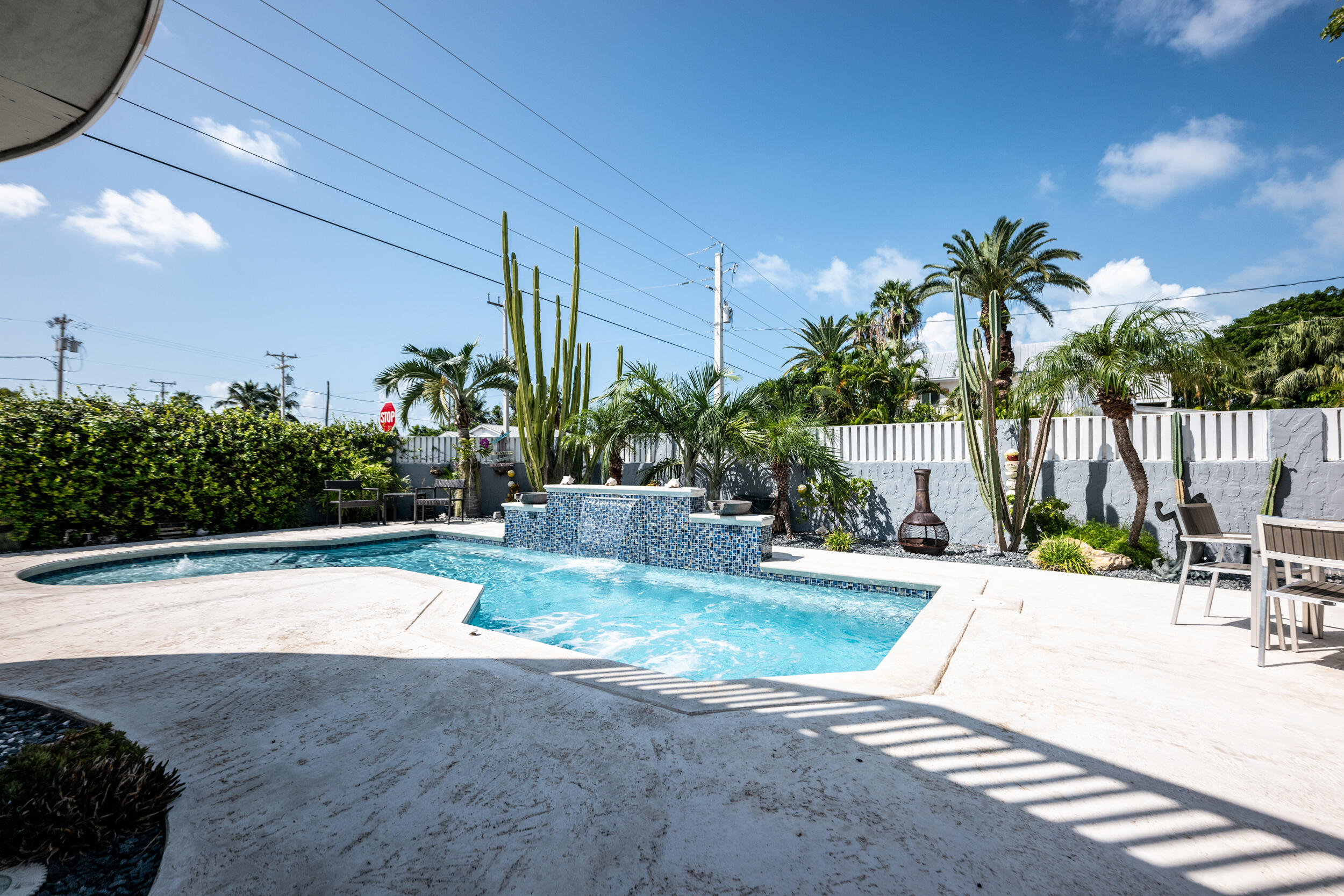1229 5th Street Key West, FL 33040 - Photo 25 of 40 a view of a backyard with plants and palm tree