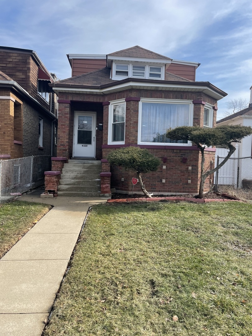front view of a house with a yard
