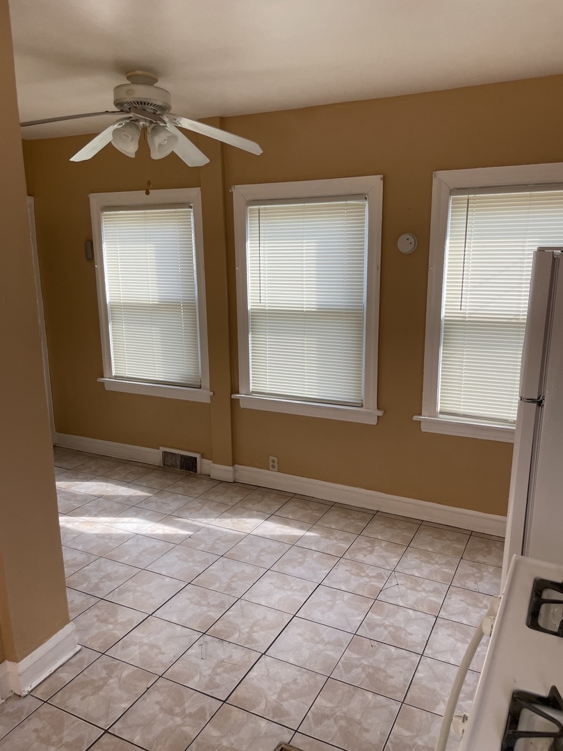 9309 South Ada Street Chicago, IL 60620 - Photo 12 of 39 an empty room with windows and closet