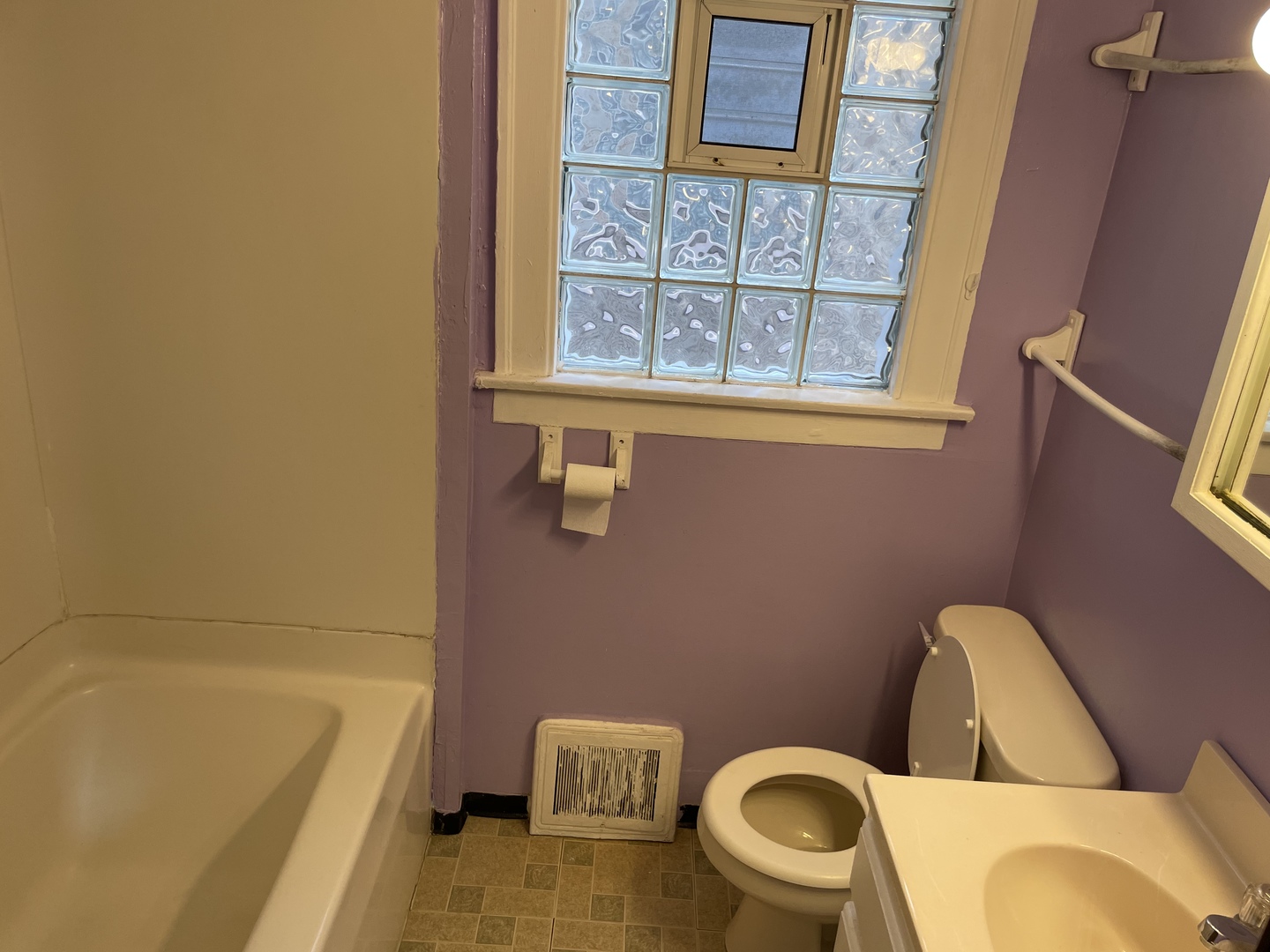 9309 South Ada Street Chicago, IL 60620 - Photo 21 of 39 a bathroom with a sink and a toilet
