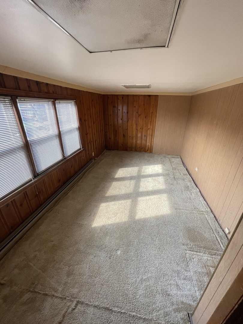 9309 South Ada Street Chicago, IL 60620 - Photo 29 of 39 a view of an empty room and window
