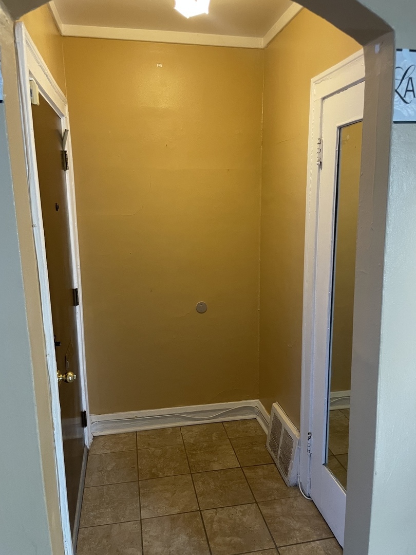 9309 South Ada Street Chicago, IL 60620 - Photo 4 of 39 a view of a bathroom with a sink