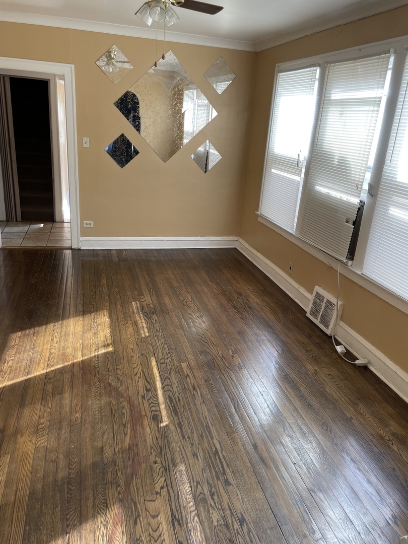 9309 South Ada Street Chicago, IL 60620 - Photo 8 of 39 a view of a livingroom with wooden floor