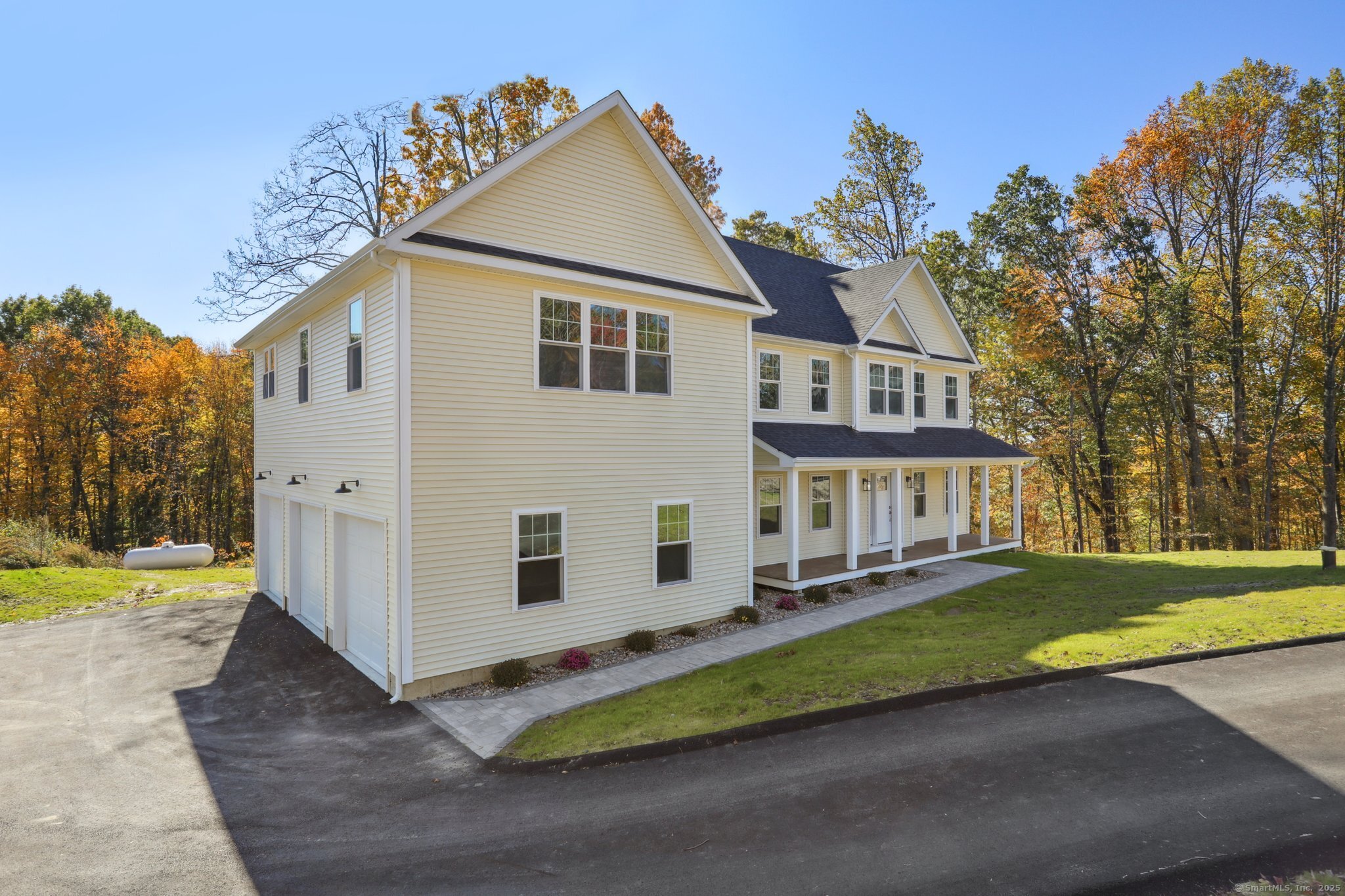19 A Apache Drive Brookfield, CT 06804 - Photo 2 of 28 a front view of a house with a yard and trees