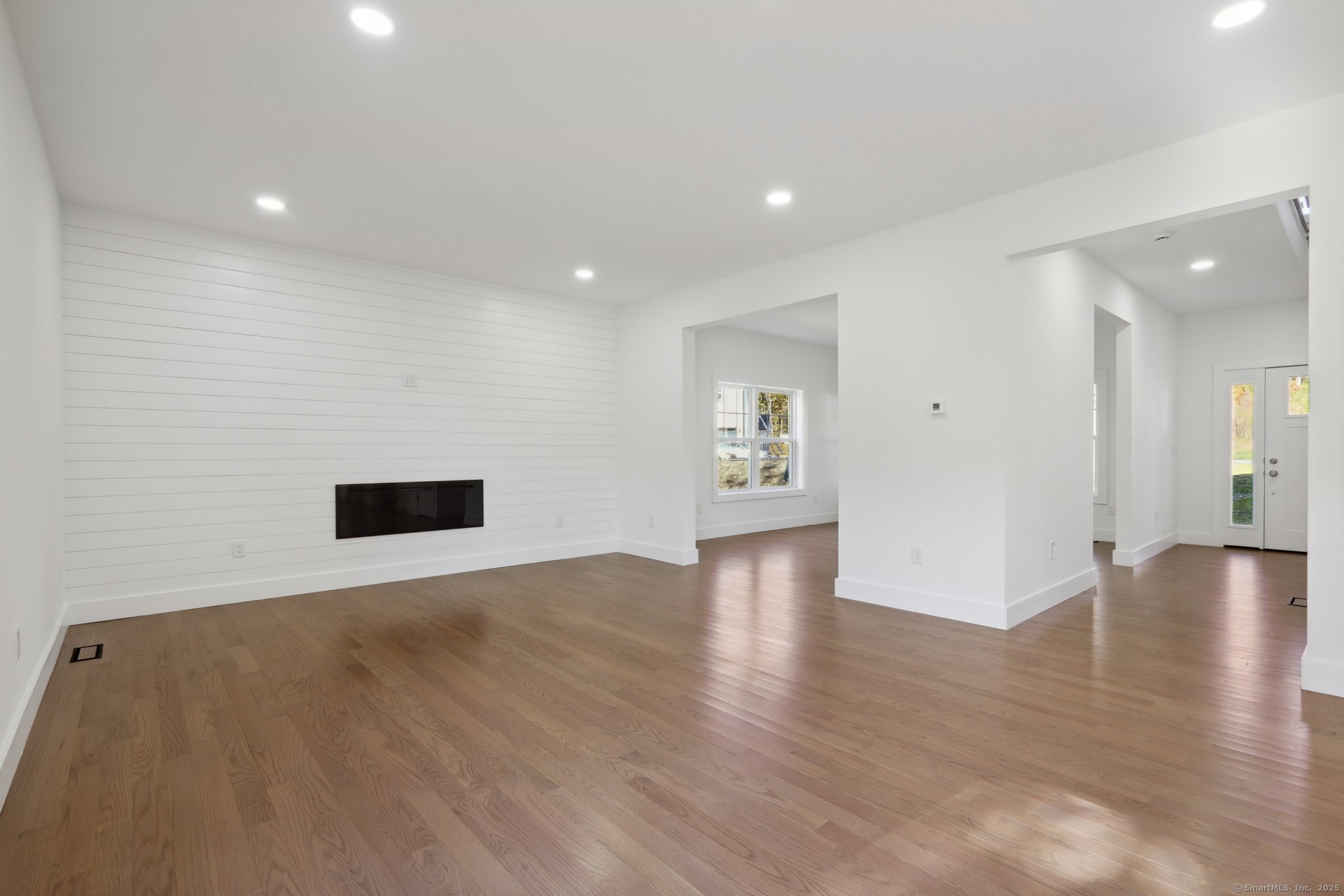 19 A Apache Drive Brookfield, CT 06804 - Photo 7 of 28 a view of an empty room with wooden floor