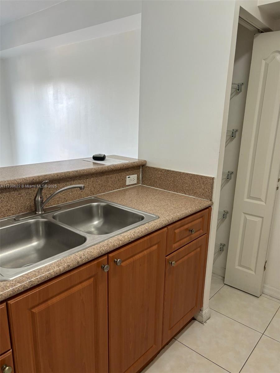 West Flagler Miami, FL 33125 - Photo 4 of 11 a view white cabinets and sink